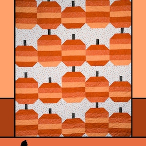 May include: A quilt featuring a repeating pattern of orange and light orange pumpkins with black stems against a white background with small black and orange dots. The text "Pumpkin Parade" is at the top, and the designer's name is at the bottom.