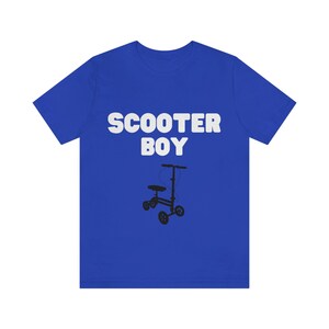 May include: A royal blue t-shirt with the text "Scooter Boy" in white letters and a black silhouette of a scooter.