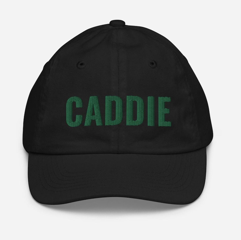 May include: Black baseball cap with the word "CADDIE" embroidered in green.