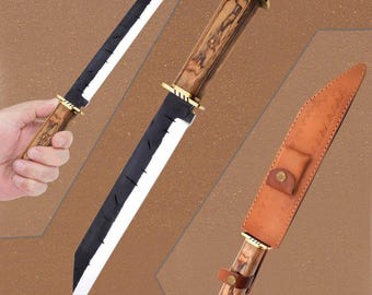May include: Three knives with wooden handles and black blades are displayed. One knife is held by a hand. The blades have a white edge. A brown leather sheath with a button closure is also shown. The knives have gold-colored accents.