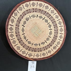 May include: A rustic wooden sign with the text "Welcome to our home" in white lettering. The sign features a distressed finish and a simple, inviting design, perfect for entryway decor.