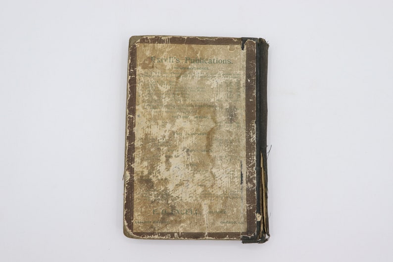 May include: A vintage book with a brown cover and a faded, worn title page. The title page reads "Ewell's Publications." The book is in a worn condition, with visible signs of age and use.