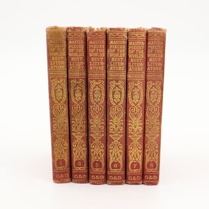 May include: A set of eight red hardcover books with gold lettering and decorative designs. The books are titled "Master Pieces of the World's Best Literature" and are numbered 1 through 8. The books are published by G&D.