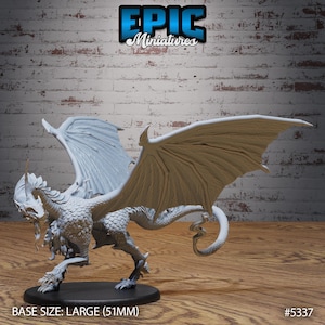 May include: A white dragon miniature with wings outstretched. The dragon has a long, slender body with a small head and a long tail. The miniature is made of white plastic and is approximately 51mm in size. The miniature is posed in a dynamic stance, with its wings spread wide and its head tilted slightly to the side. The miniature is a great addition to any tabletop game or collection.