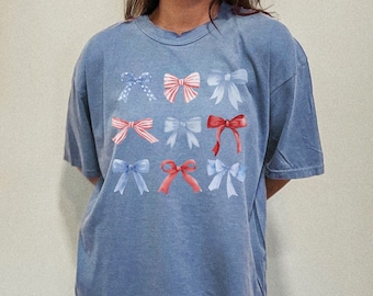 独立記念日のリボンシャツ | コケットTシャツ | USAシャツ | 愛国的なシャツ | コンフォートカラーTシャツ | コケットリボンシャツ | 独立記念日のTシャツ | トレンディ