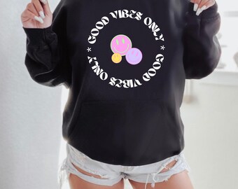 May include: Black hoodie with a white circle graphic that says "Good Vibes Only" with three smiley faces inside the circle.