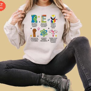 Resist Sweatshirt - Respect Mother Earth, Empower Education, Spread Love, Inclusion, Diversity, Pro-Choice, Science Drives Progress Bild 3