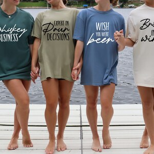 a group of women standing on top of a boat