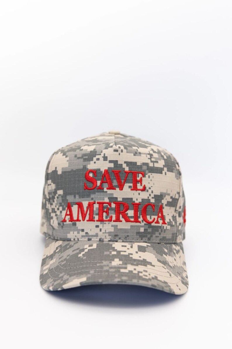 May include: A camouflage baseball cap with the words "SAVE AMERICA" embroidered in red.
