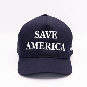 May include: A dark blue baseball cap with the text "SAVE AMERICA" embroidered in white.