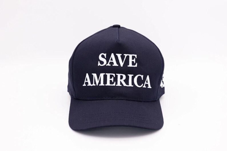 May include: A dark blue baseball cap with the text "SAVE AMERICA" embroidered in white.