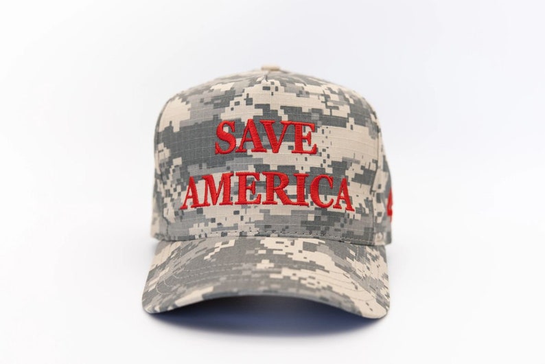 May include: A camouflage baseball cap with the words "SAVE AMERICA" embroidered in red.