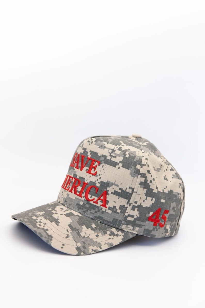 May include: A camouflage baseball cap with the words "Save America" and the number "45" embroidered in red.