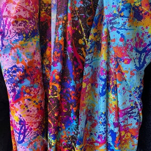 Graffiti paint splatter design with foil on nylon spandex fabric four way stretch sold by the yard