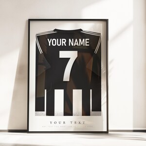 May include: Black and white framed print of a soccer jersey with a number 7 and the text "YOUR NAME" and "YOUR TEXT".