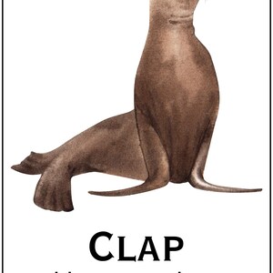 May include: Watercolor illustration of a brown sea lion with the text "CLAP like a sea lion" in bold black letters. The text "SIENTA SASIKA NOVEL" is at the top of the image.