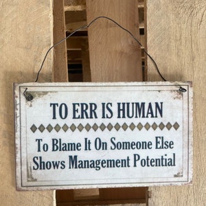 Vintage Distressed Style Hanging Metal Sign "To Err Is Human. To Blame It On Someone Else Shows Management Potential" Retro Funny Sign