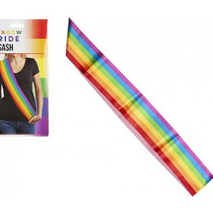May include: Rainbow Pride Sash with the words "Rainbow Pride Sash" printed on the packaging. The sash is made of colorful satin ribbon with a rainbow pattern.