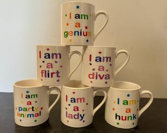 I am a... Ceramic Mug in 6 Designs - Diva, Genius, Flirt, Lady, Hunk, Party Animal - Hot Chocolate Coffee Tea Cup Mug Novelty Gift Pride