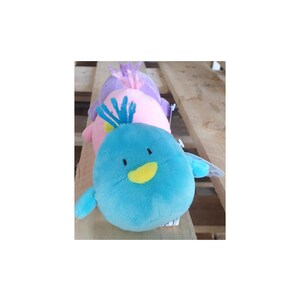 May include: Three plush toys in the shape of birds. The bird in the front is blue with a yellow beak and a blue and white crest. The middle bird is pink with a purple crest. The back bird is purple.