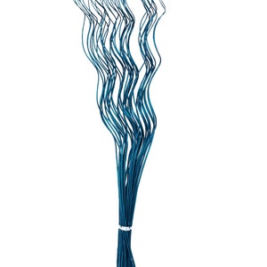 May include: A bunch of teal blue artificial willow branches, with the stems bundled together at the bottom.