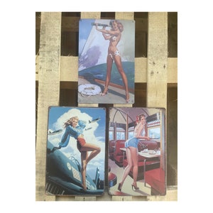 Vintage Metal Hanging Signs with Classic Pin Up Prints and a Retro Theme. 3 Designs, Each Measures 30cm x 20cm with Corner Hanging Holes