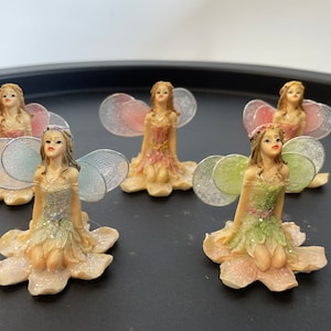 Fairy Ornament, Delicate Miniature Fairy with Glitter Gossamer Wings in Baby Blue, Green, or Pink. **Damage to the noses as shown**