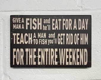 Hanging Wooden Sign "Give A Man A Fish And He'll Eat For A Day. Teach A Man To Fish And You'll Get Rid Of Him For The Entire Weekend 25x16cm