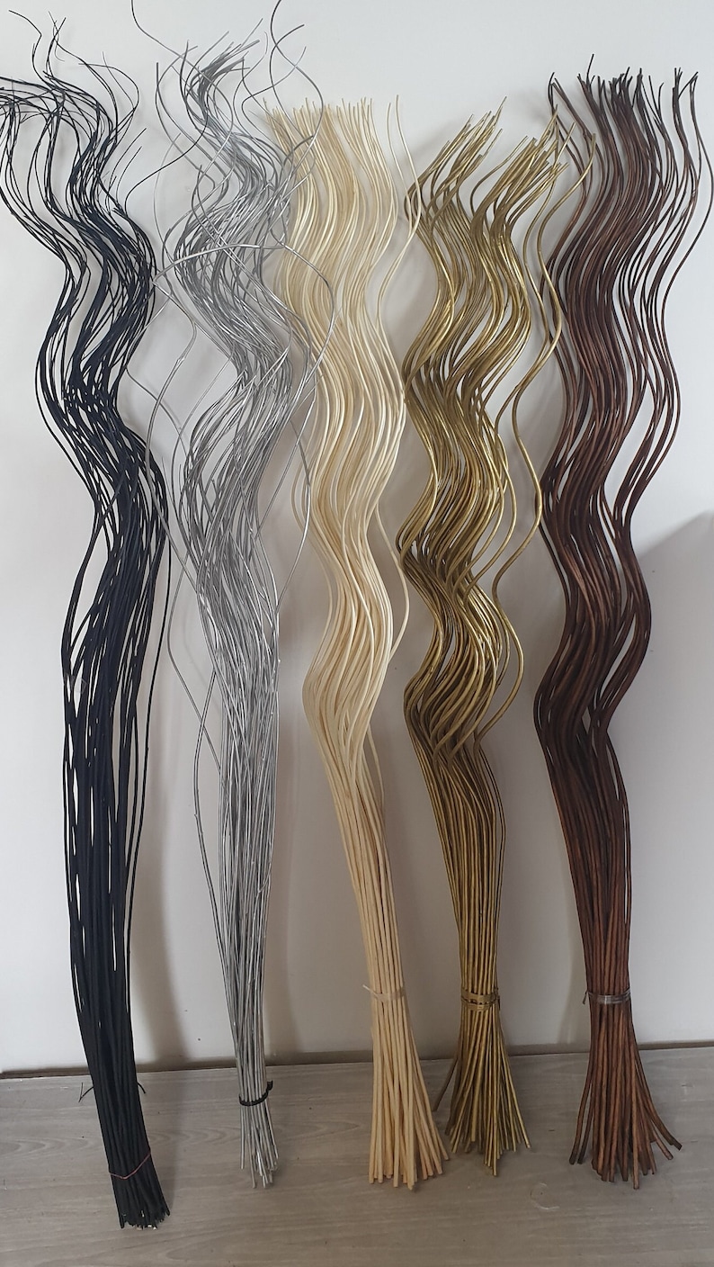 May include: Five bundles of wavy, flexible stems in different colors: black, silver, cream, gold, and brown. The stems are tied together at the bottom.