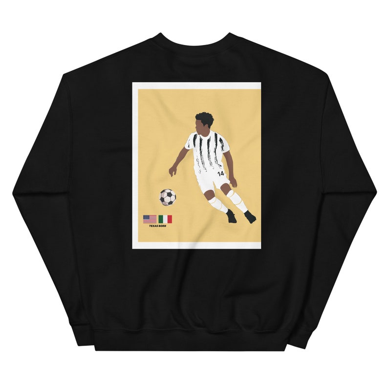 May include: Black sweatshirt with a graphic print of a soccer player in a black and white jersey kicking a soccer ball. The graphic also includes the text "Texas Born" and the flags of the United States and Italy.