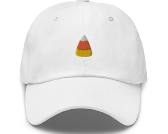 May include: White baseball cap with an embroidered candy corn design.