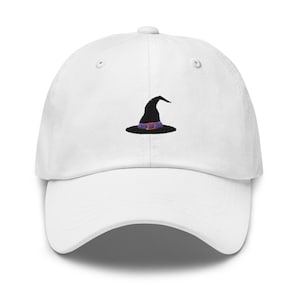 May include: White baseball cap with a black witch hat embroidered on the front.