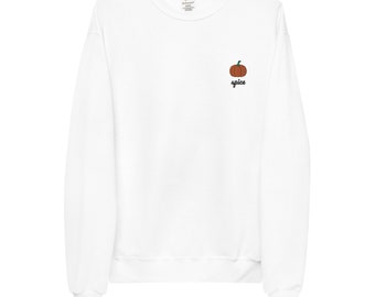 May include: White long-sleeved sweatshirt with a small embroidered pumpkin and the word "spice" underneath.