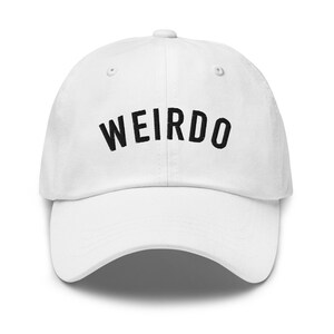 May include: White baseball cap with black embroidered text that reads "WEIRDO".