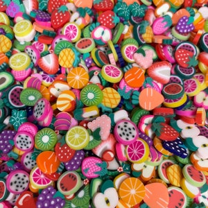 May include: A large collection of colourful, flat, polymer clay charms in various fruit and food shapes. The charms are perfect for adding a fun and whimsical touch to jewellery, keyrings, and other crafts.