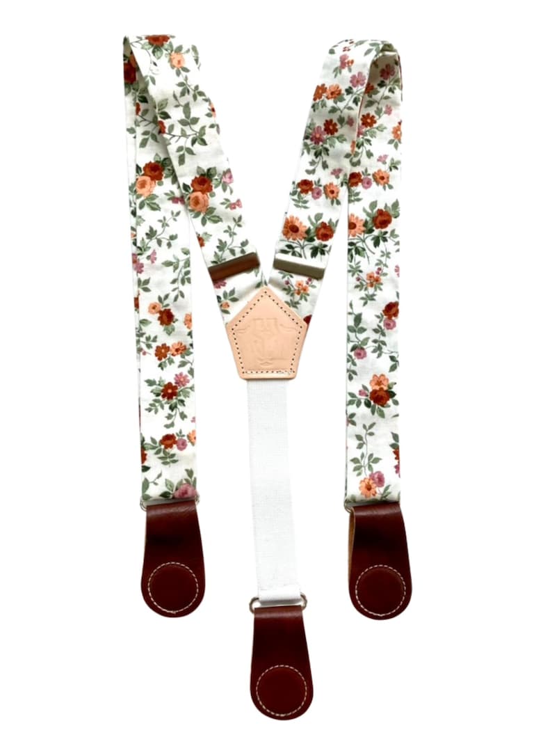 Rustic rose floral suspenders with cognac leather magnetic clasps, boho women’s accessory for fall and festival outfits.
