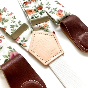 Rustic rose floral women’s suspenders with leather magnetic clasps, handmade boho accessory for vintage and festival outfits.