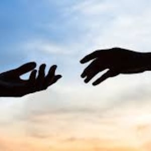 May include: Two hands reaching towards each other against a blue and orange sky. The hands are silhouetted against the sky.