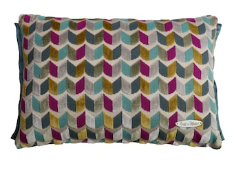 HARLIE - Multi coloured, 30 x 42cm, geometric design cut velvet boudoir cushion with a contrast teal coloured sateen trim.