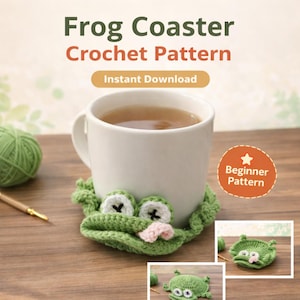 May include: A white mug with tea rests on a green crochet frog coaster. The coaster has white eyes with black crosses and a pink mouth. The text "Frog Coaster Crochet Pattern" and "Instant Download" are visible.