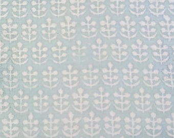 May include: A light blue fabric with a white repeating pattern of stylized plant motifs.