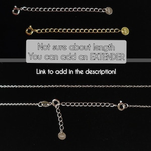 May include: Three gold chains of different lengths, each with a small round tag at the end. The text "Not sure about length You can add an EXTENDER Link to add in the description!" is displayed below the chains.