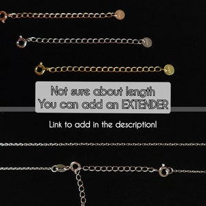 May include: Three silver chains of different lengths, with a clasp and a small tag at the end of each chain. The text "Not sure about length You can add an EXTENDER Link to add in the description!" is written below the chains.