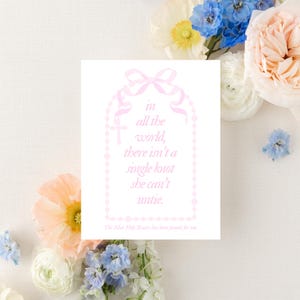 May include: A pink and white card with a quote about a rosary: "in all the world, there isn't a single knot she can't untie." The card has a pink rosary design around the quote.