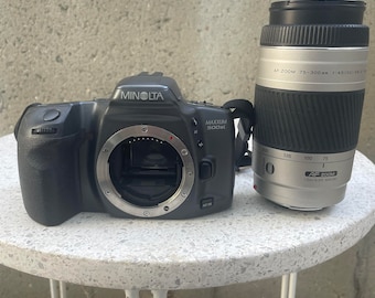 Minolta Maxxum 500si 35mm Camera with a Minolta AF 75-300mm lens