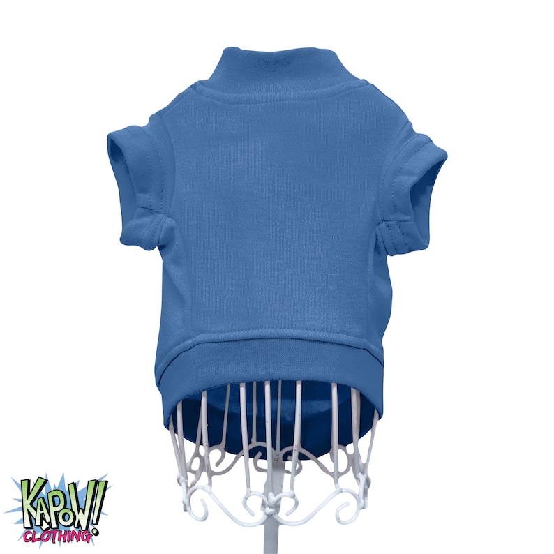 May include: A solid blue short-sleeved shirt for a pet. The shirt is on a white mannequin.