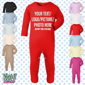 May include: A long-sleeved red baby bodysuit with snap closures at the crotch. The chest features white text that reads: YOUR TEXT/ LOGO/PICTURE/ PHOTO HERE (IN ANY FONT/COLOUR). The image displays a central red bodysuit surrounded by various solid-coloured versions.