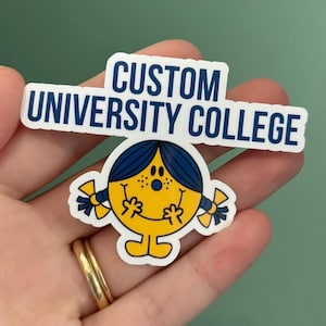 May include: A yellow sticker with a cartoon character design, blue hair and pigtails. The sticker has the text "CUSTOM UNIVERSITY COLLEGE" in blue on a white background.