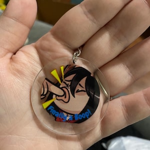 May include: A clear acrylic keychain with a cartoon image of a person yelling. The keychain has a silver metal ring. The text "Finally a Boop!" is written in blue and red.