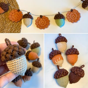 May include: A garland of crocheted acorns and flowers. The acorns are brown, beige, and green. The flowers are orange. The garland is strung on a white string.